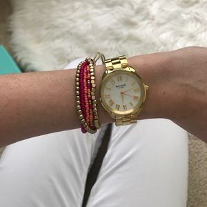 Kate Spade watch w/ pink bracelets.